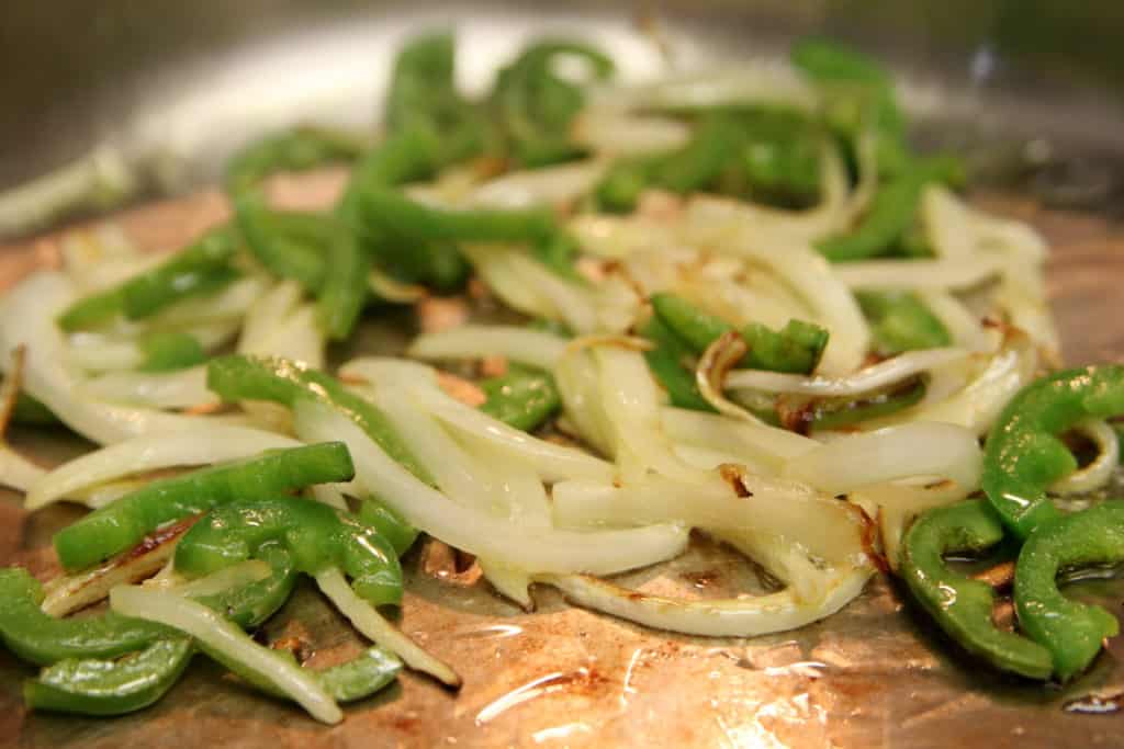 Onions and peppers for your brisket taquitos