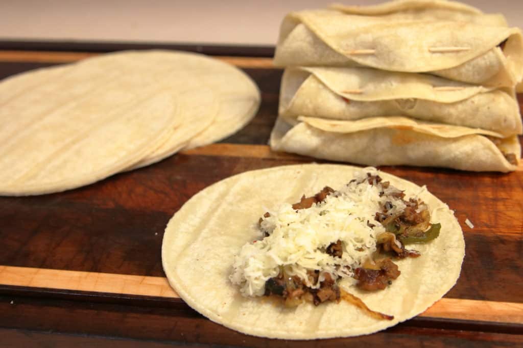 Leftover smoked brisket taquitos, wrapped and unwrapped