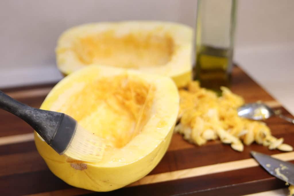 Brush spaghetti squash with olive oil