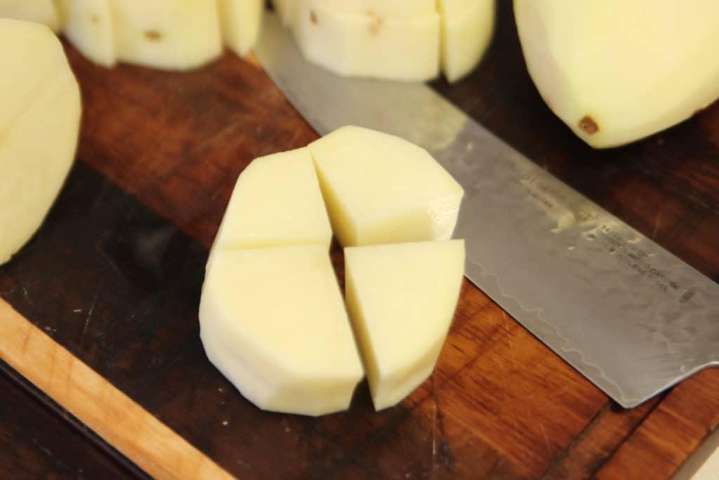 Cut each potato slice into four cubes