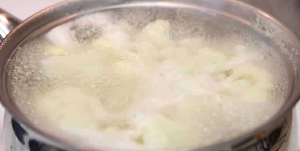 Cauliflower boiling in pot