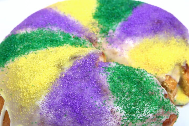 Mardi Gras King Cake with icing and sugar sprinkles