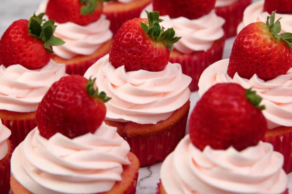 Strawberries and Cream cupcakes with fresh strawberries on top