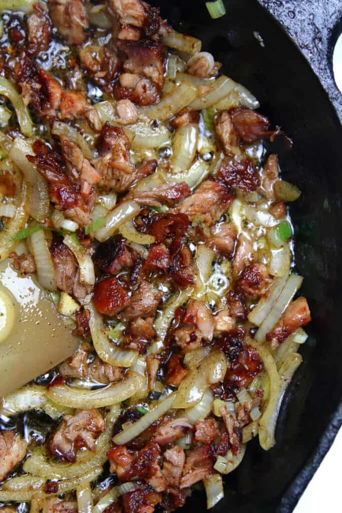 Skillet of sauteed onions and leftover ribs