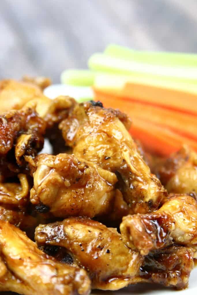 Chicken Drumettes glazed in wing sauce with carrots and celery