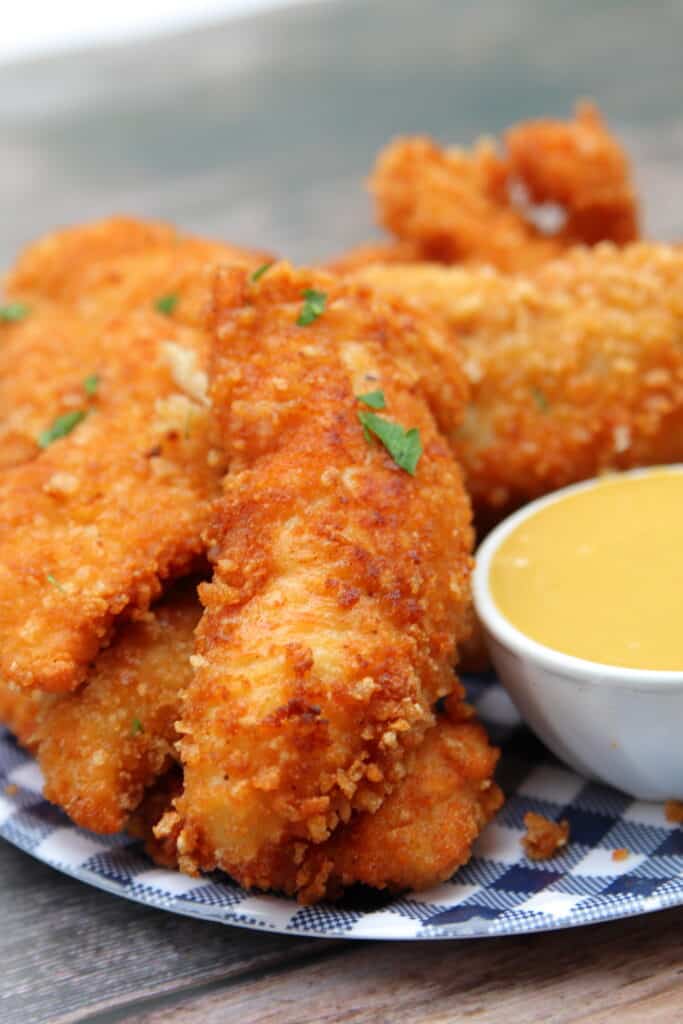 Plate full of crispy homemade chicken tenders