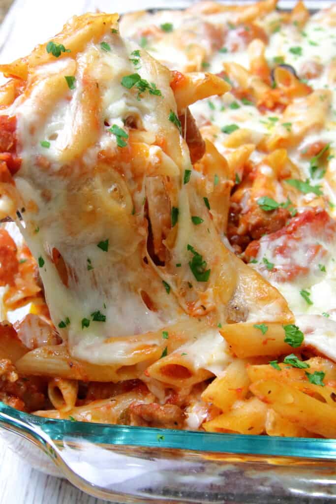 Pizza pasta bake with stringy mozzarella cheese