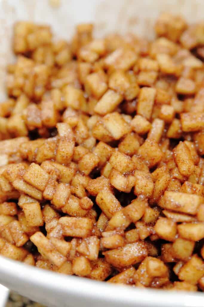 Close up of diced apples coated in apple spice.