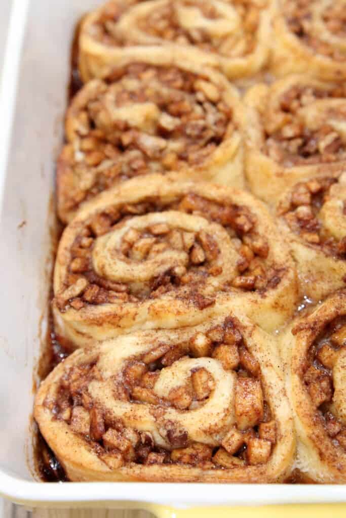 Closeup of a pan of baked apple pie cinnamon rolls