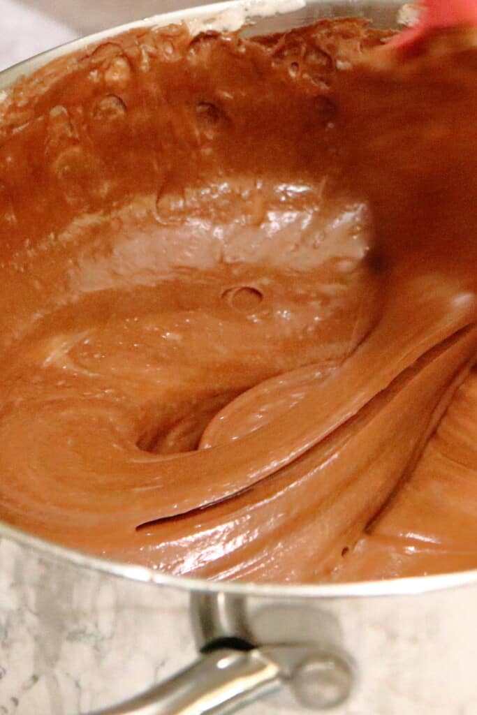 melted chocolate in a bowl being stirred