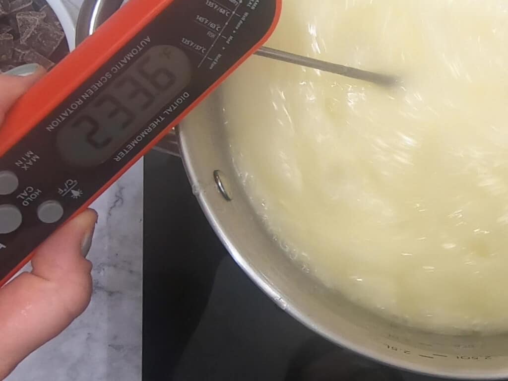 thermometer in a heated pan of butter reading 233.6F