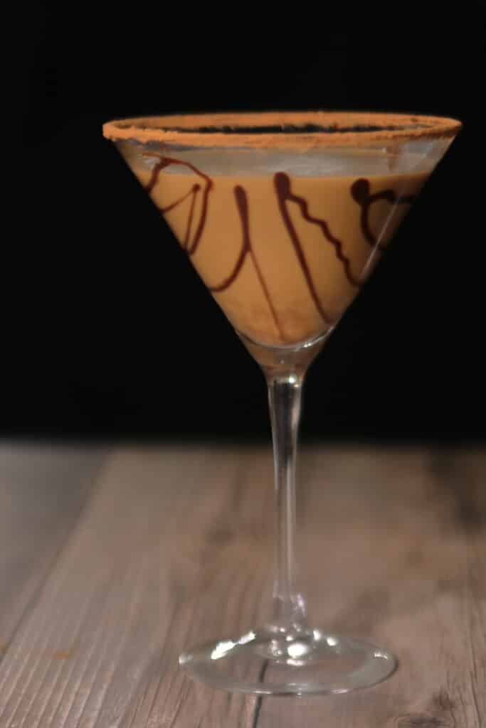Closeup of chocolate martini with chocolate drizzle