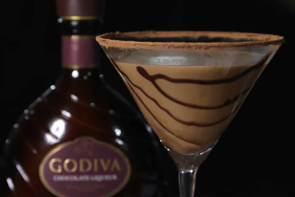 chocolate martini with a bottle of chocolate liqueur