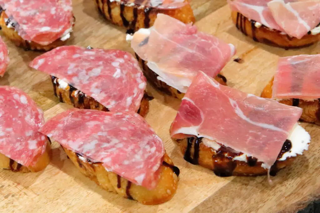 goat cheese crostini with prosciutto or sopressata on top